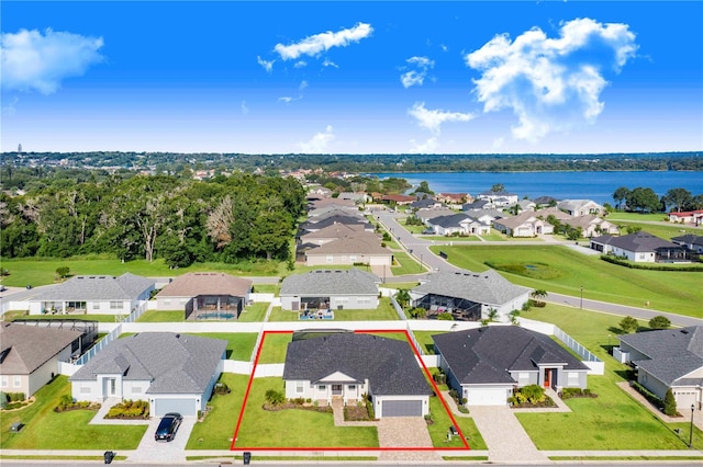 birds eye view of property featuring a water view