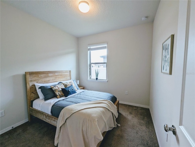 bedroom featuring dark carpet