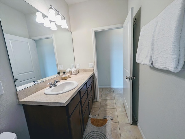 bathroom featuring tile patterned flooring and vanity