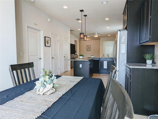 tiled dining room with sink