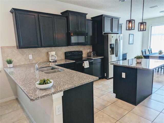 kitchen featuring sink, black appliances, light stone counters, and light tile patterned floors