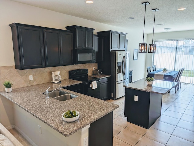 kitchen with decorative backsplash, light stone counters, sink, decorative light fixtures, and black appliances