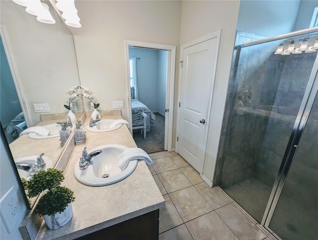 bathroom featuring dual vanity, tile patterned floors, and a shower with shower door