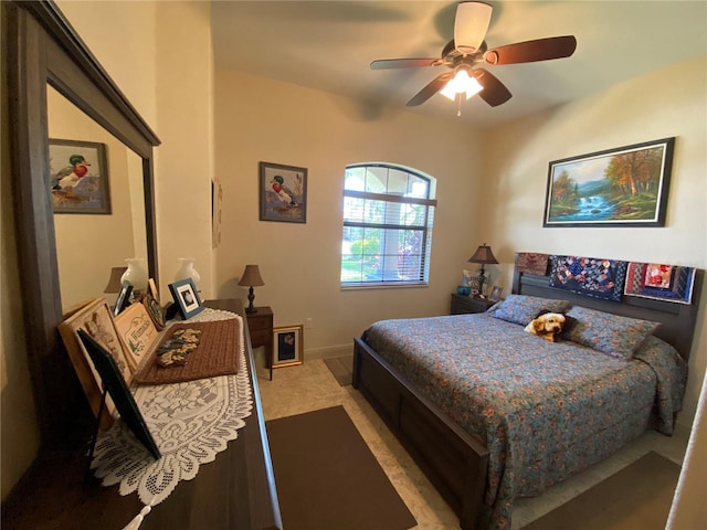 bedroom featuring ceiling fan and baseboards