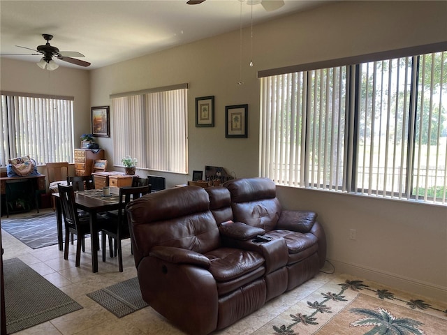 tiled living room with ceiling fan and a healthy amount of sunlight