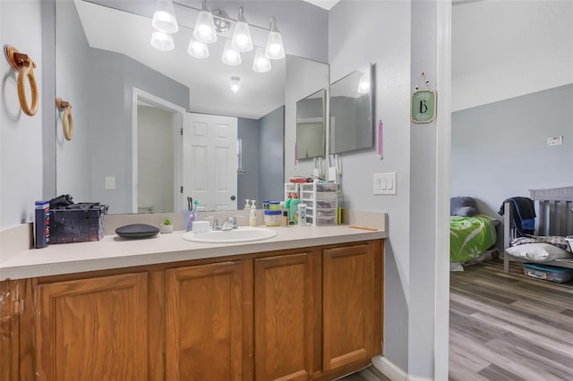 bathroom with hardwood / wood-style flooring and vanity