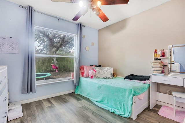 bedroom with hardwood / wood-style floors and ceiling fan