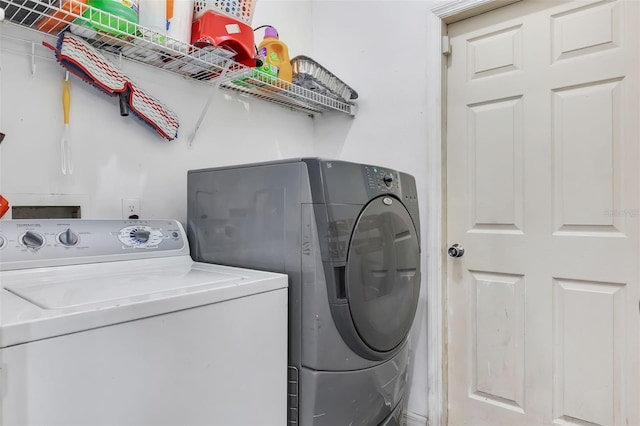 washroom featuring washer and dryer