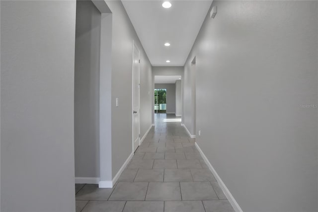 hallway featuring light tile patterned floors