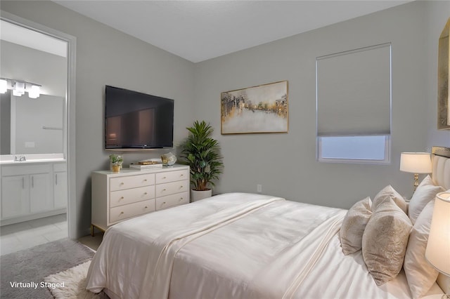 bedroom featuring ensuite bathroom