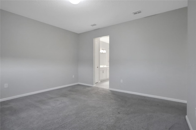 empty room featuring light colored carpet