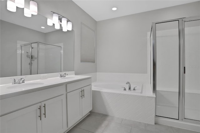 bathroom featuring tile patterned floors, vanity, and plus walk in shower