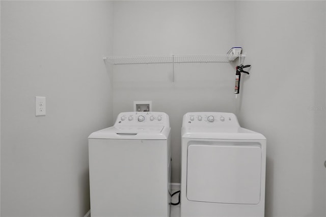 washroom featuring washer and dryer