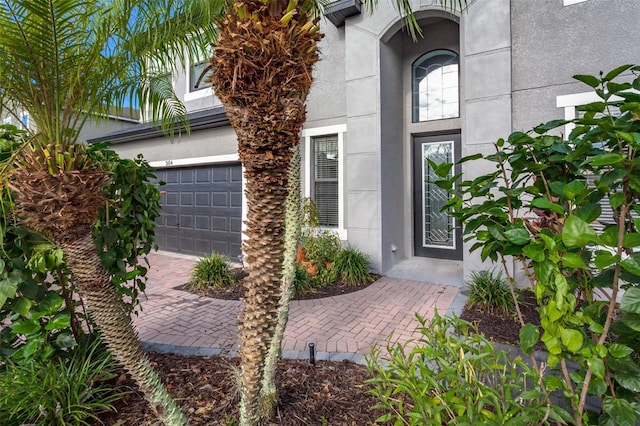 doorway to property featuring a garage