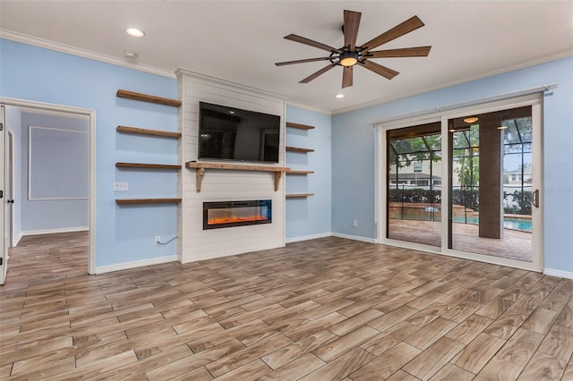 unfurnished living room with ornamental molding, a fireplace, light hardwood / wood-style floors, and ceiling fan