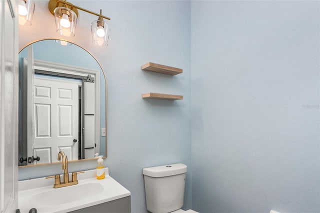 bathroom with vanity and toilet