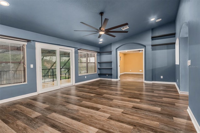 interior space featuring lofted ceiling, dark wood-type flooring, and ceiling fan