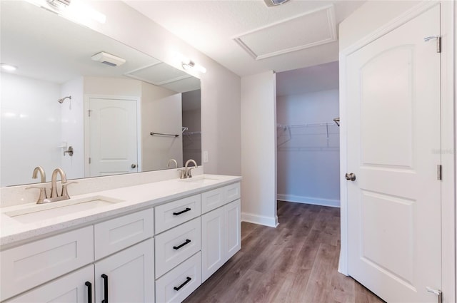 bathroom with vanity and hardwood / wood-style floors