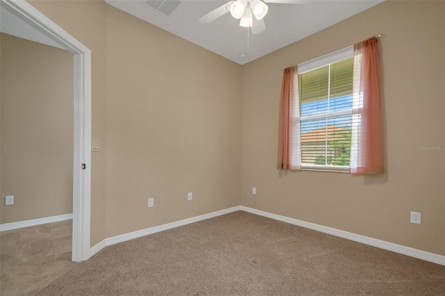 carpeted empty room featuring ceiling fan