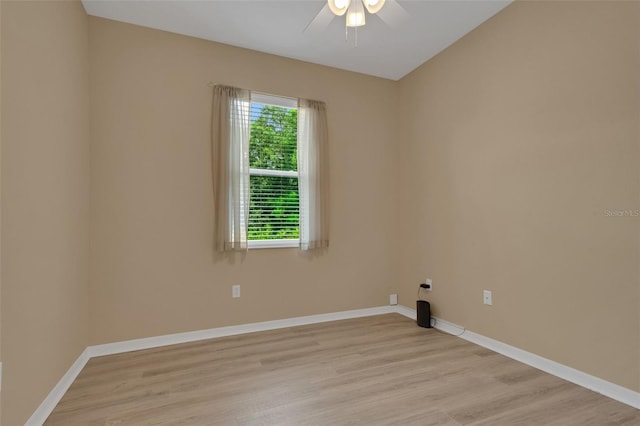 spare room featuring light hardwood / wood-style flooring and ceiling fan