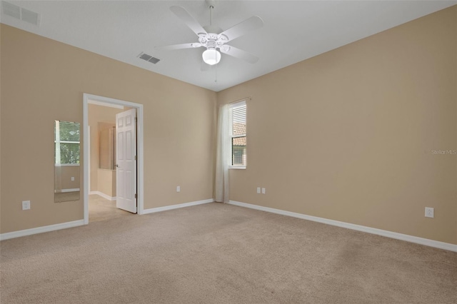 carpeted empty room with ceiling fan