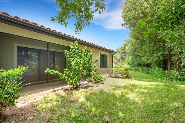 view of yard with a sunroom