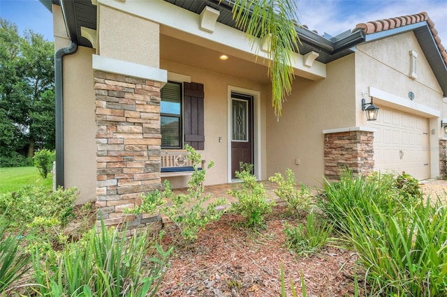 entrance to property featuring a garage