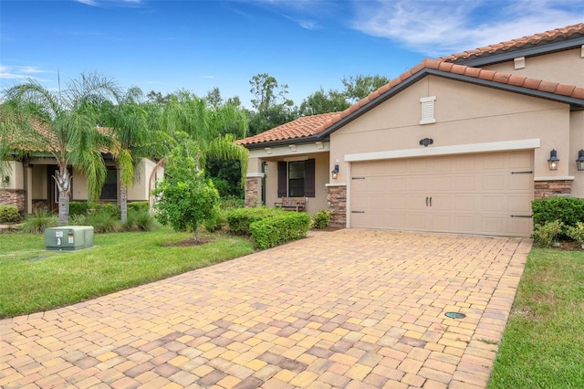 mediterranean / spanish-style house featuring a garage and a front lawn