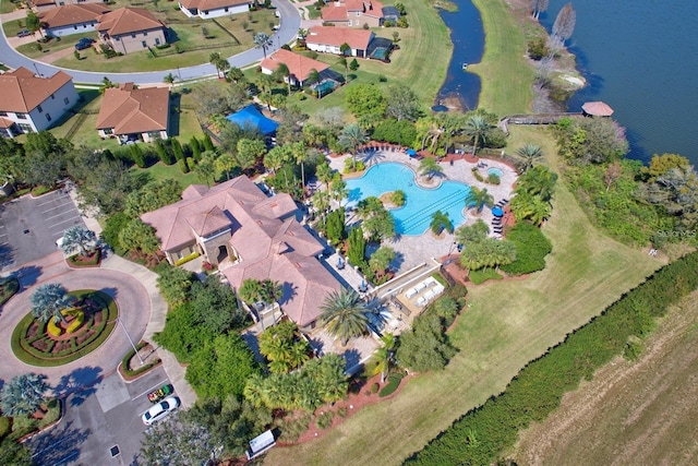 birds eye view of property with a water view