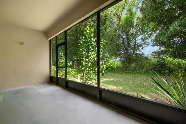 unfurnished sunroom with a wealth of natural light