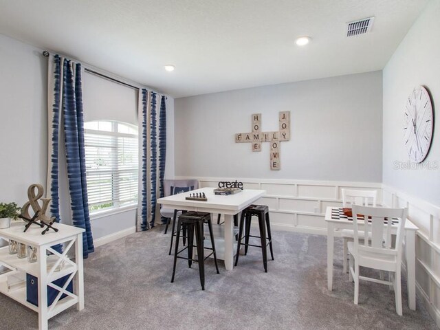 view of carpeted dining space