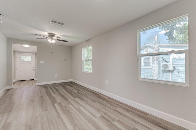 unfurnished room featuring ceiling fan and light hardwood / wood-style floors