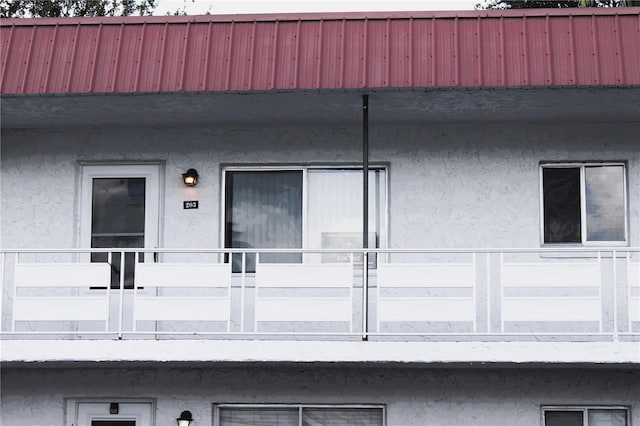 doorway to property featuring a balcony