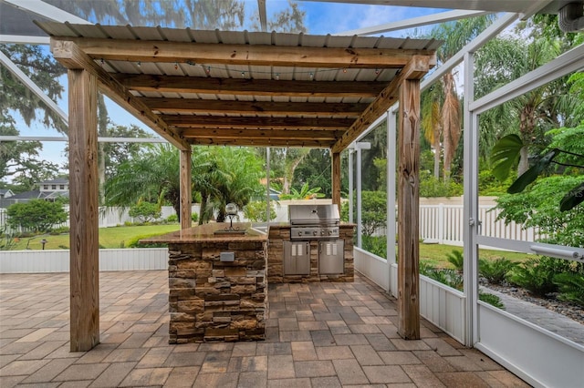 view of patio / terrace featuring a grill and exterior kitchen