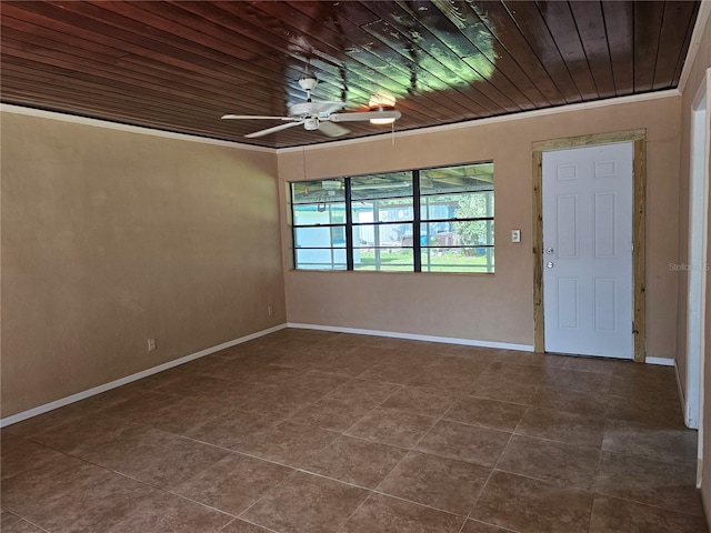 spare room with wood ceiling and tile patterned floors