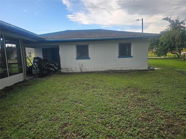 view of home's exterior featuring a yard