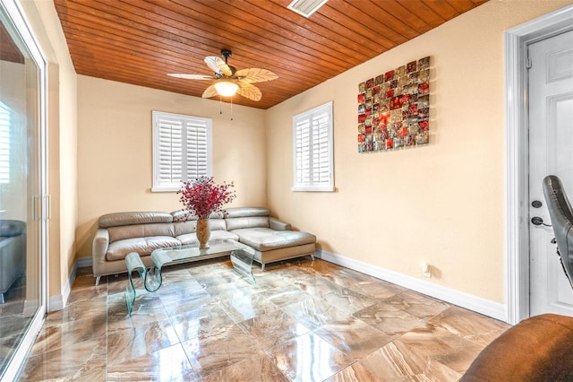 sitting room featuring wooden ceiling, baseboards, marble finish floor, and ceiling fan