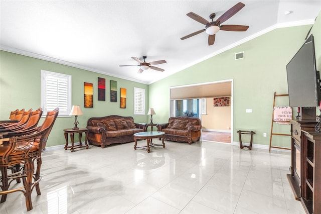 living area featuring vaulted ceiling, baseboards, visible vents, and ornamental molding