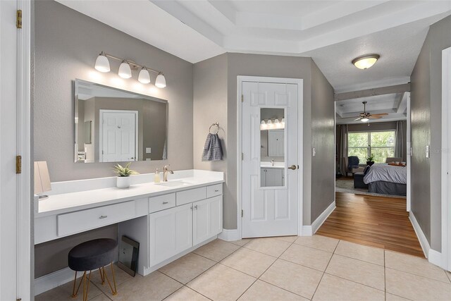 bathroom featuring ceiling fan, tile patterned flooring, a textured ceiling, and vanity