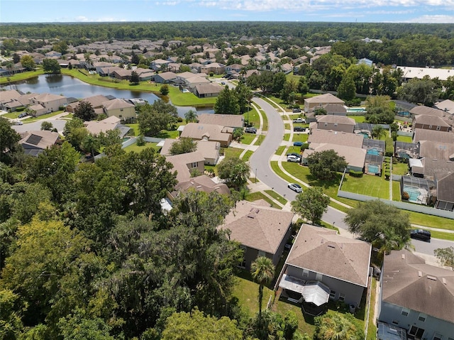 birds eye view of property featuring a water view and a residential view