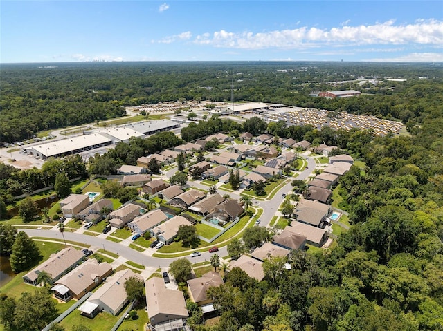 aerial view with a wooded view and a residential view