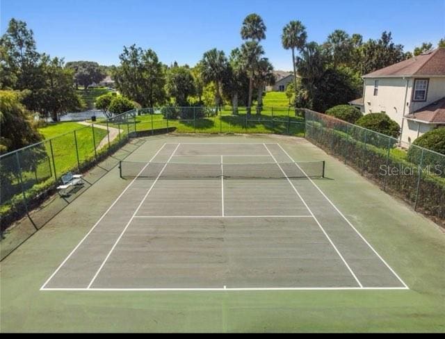 view of sport court with fence