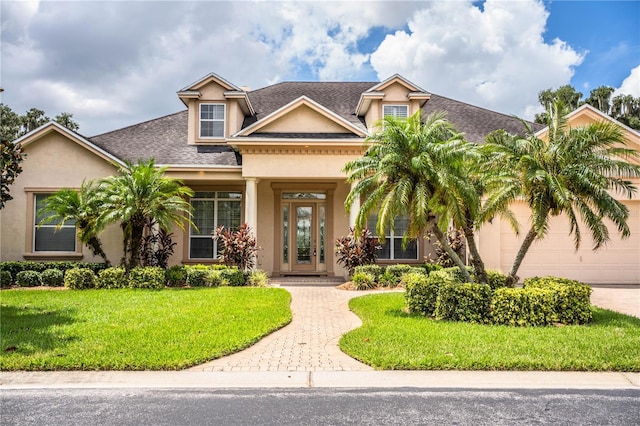 view of front of property featuring a front yard and french doors