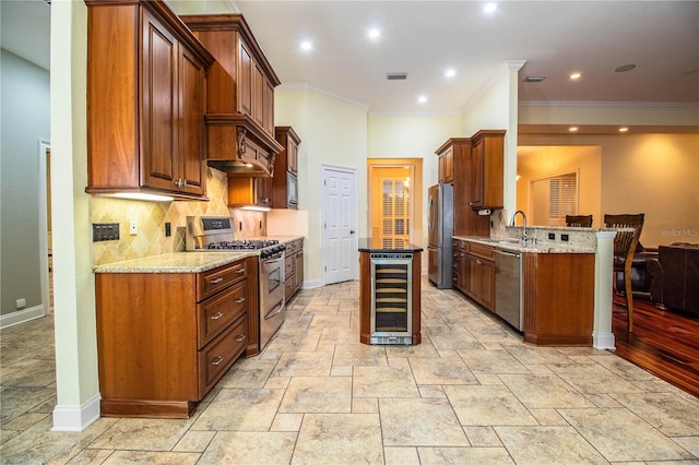 kitchen featuring wine cooler, light stone countertops, stainless steel appliances, kitchen peninsula, and light wood-type flooring