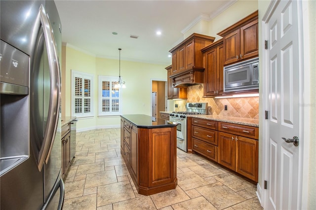 kitchen with hanging light fixtures, stainless steel appliances, a chandelier, a kitchen island, and decorative backsplash