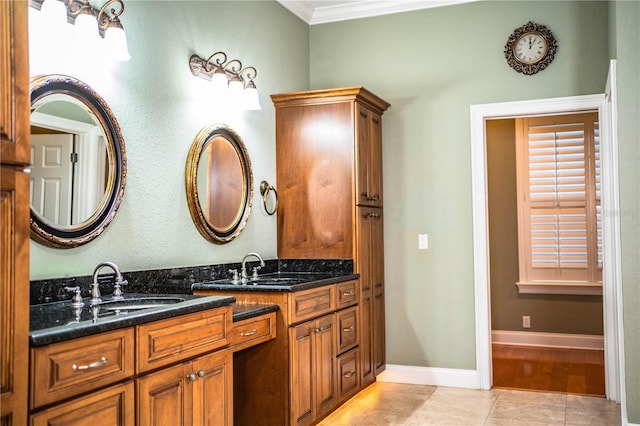 bathroom featuring crown molding, vanity, and tile patterned floors