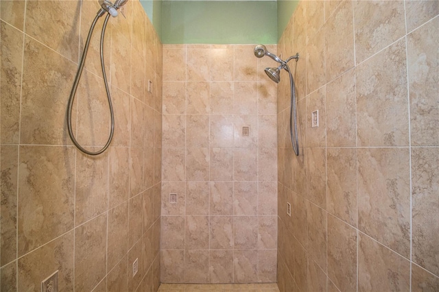 bathroom with a tile shower