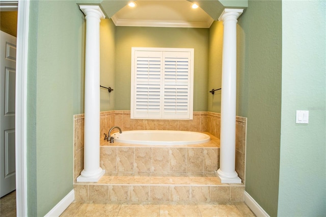 bathroom with crown molding, tiled bath, and decorative columns