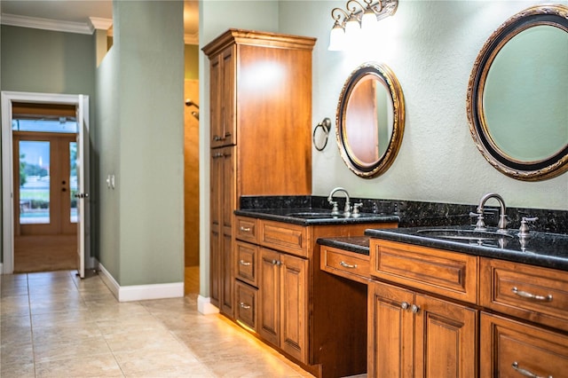 bathroom featuring crown molding and vanity