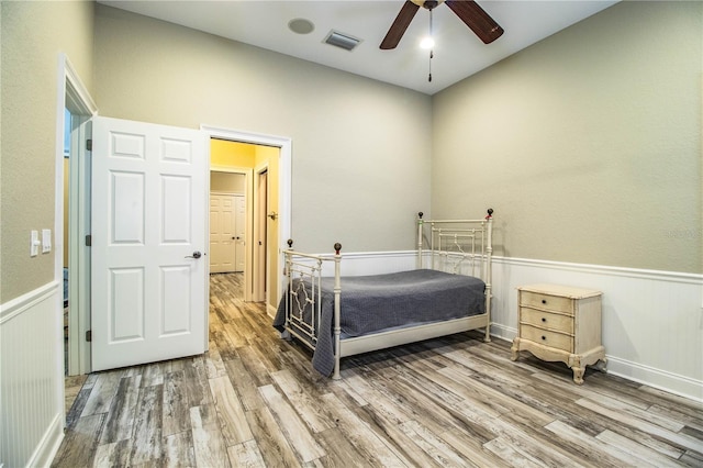 bedroom featuring ceiling fan and hardwood / wood-style flooring